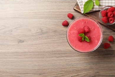 Delicious raspberry mousse with mint on wooden table, flat lay. Space for text