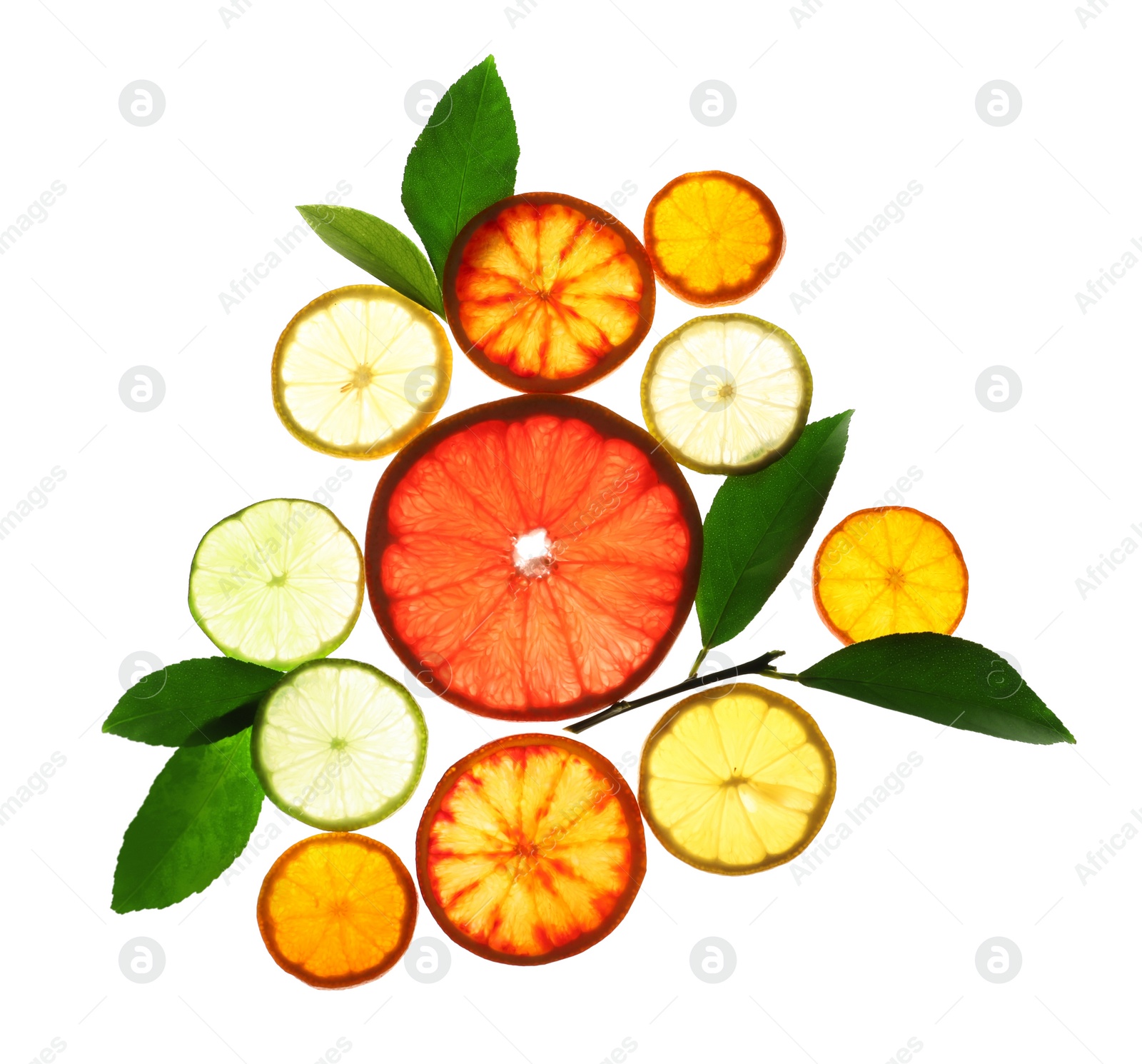 Photo of Illuminated slices of citrus fruits and leaves on white background, top view