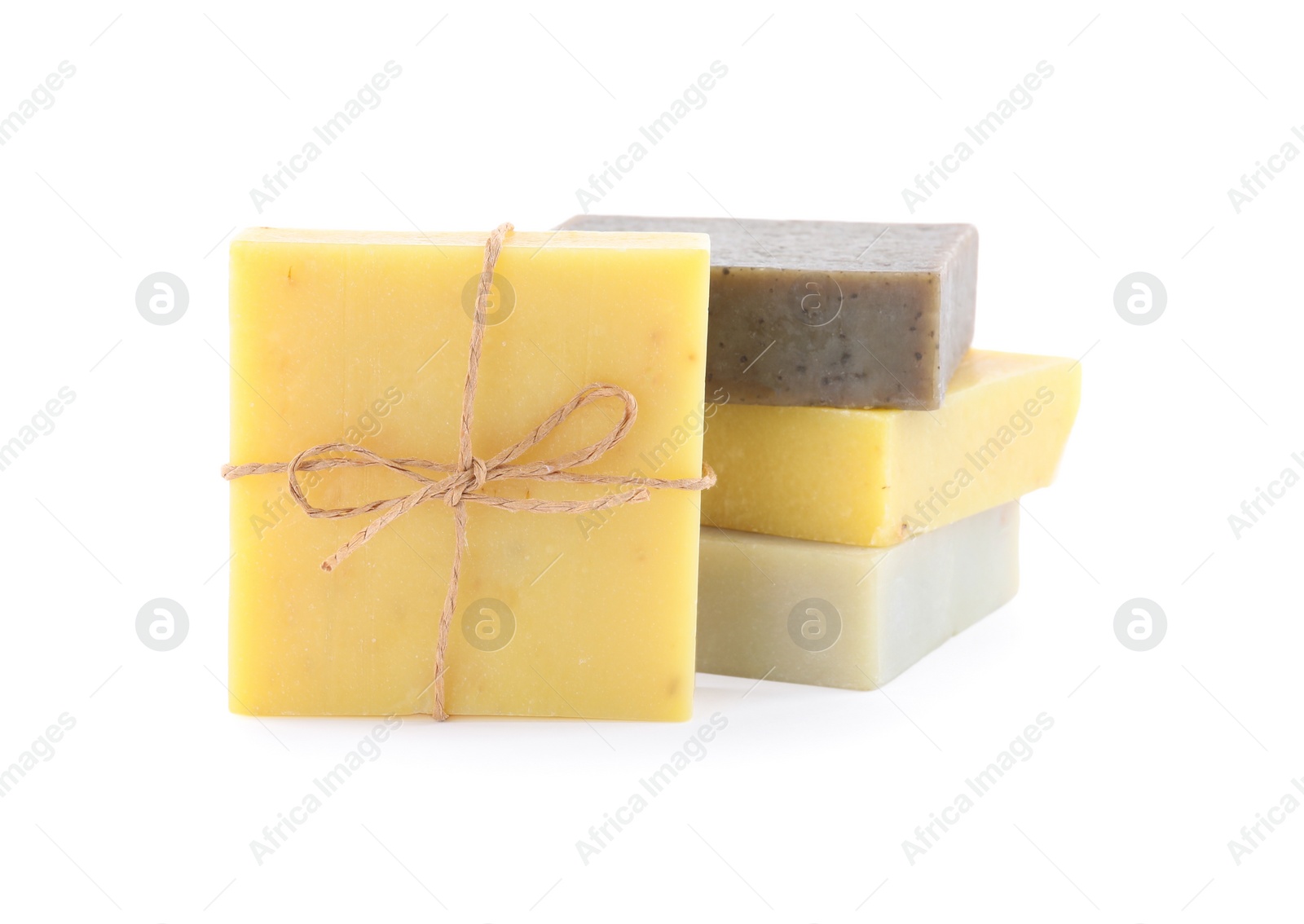 Photo of Different bars of organic handmade soap isolated on white