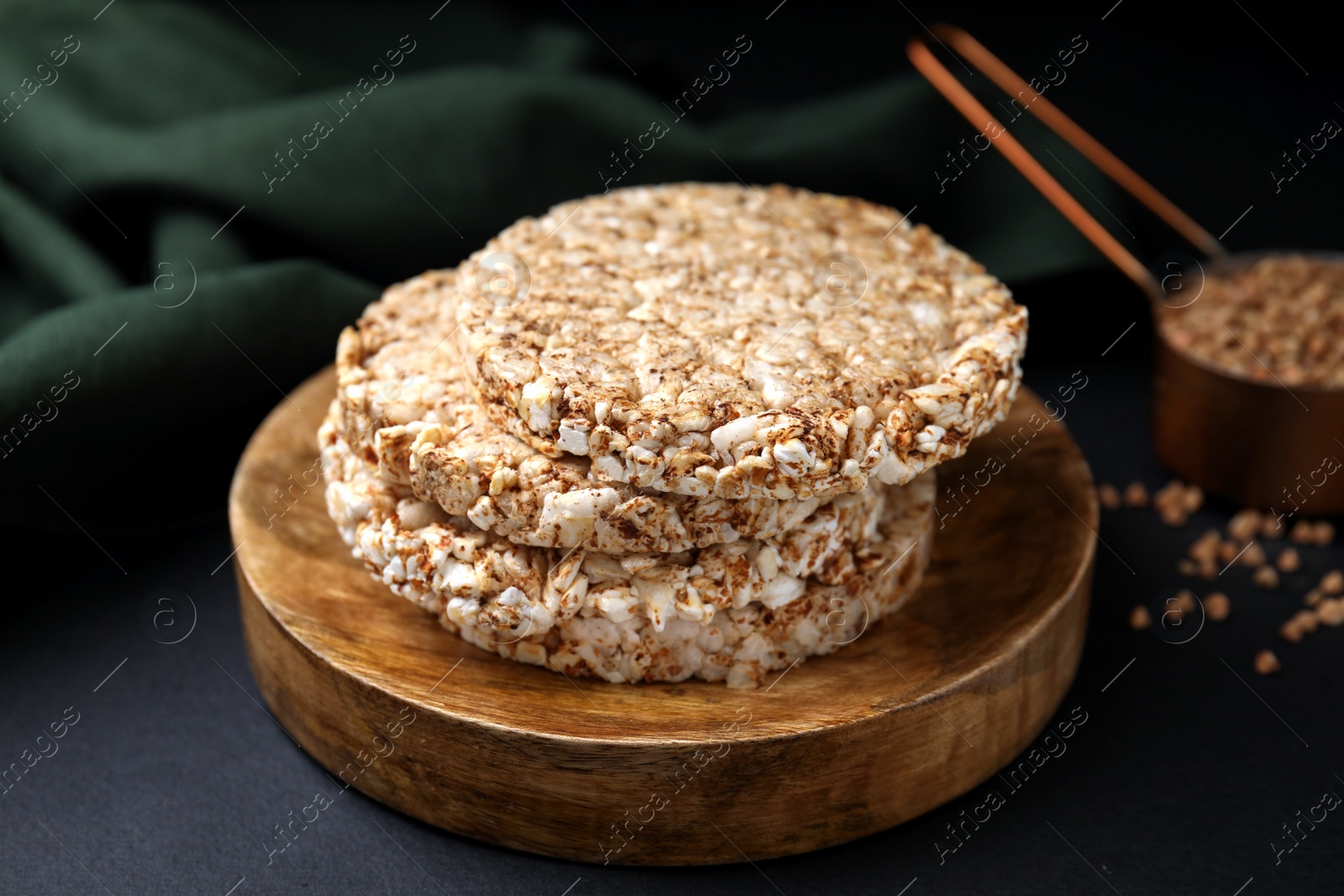 Photo of Stack of crunchy buckwheat cakes on black table