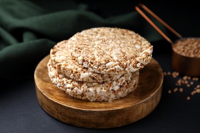 Photo of Stack of crunchy buckwheat cakes on black table