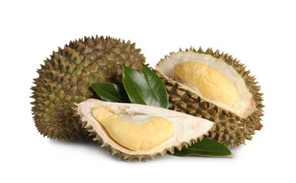 Photo of Fresh ripe durians with green leaves on white background. Tropical fruit