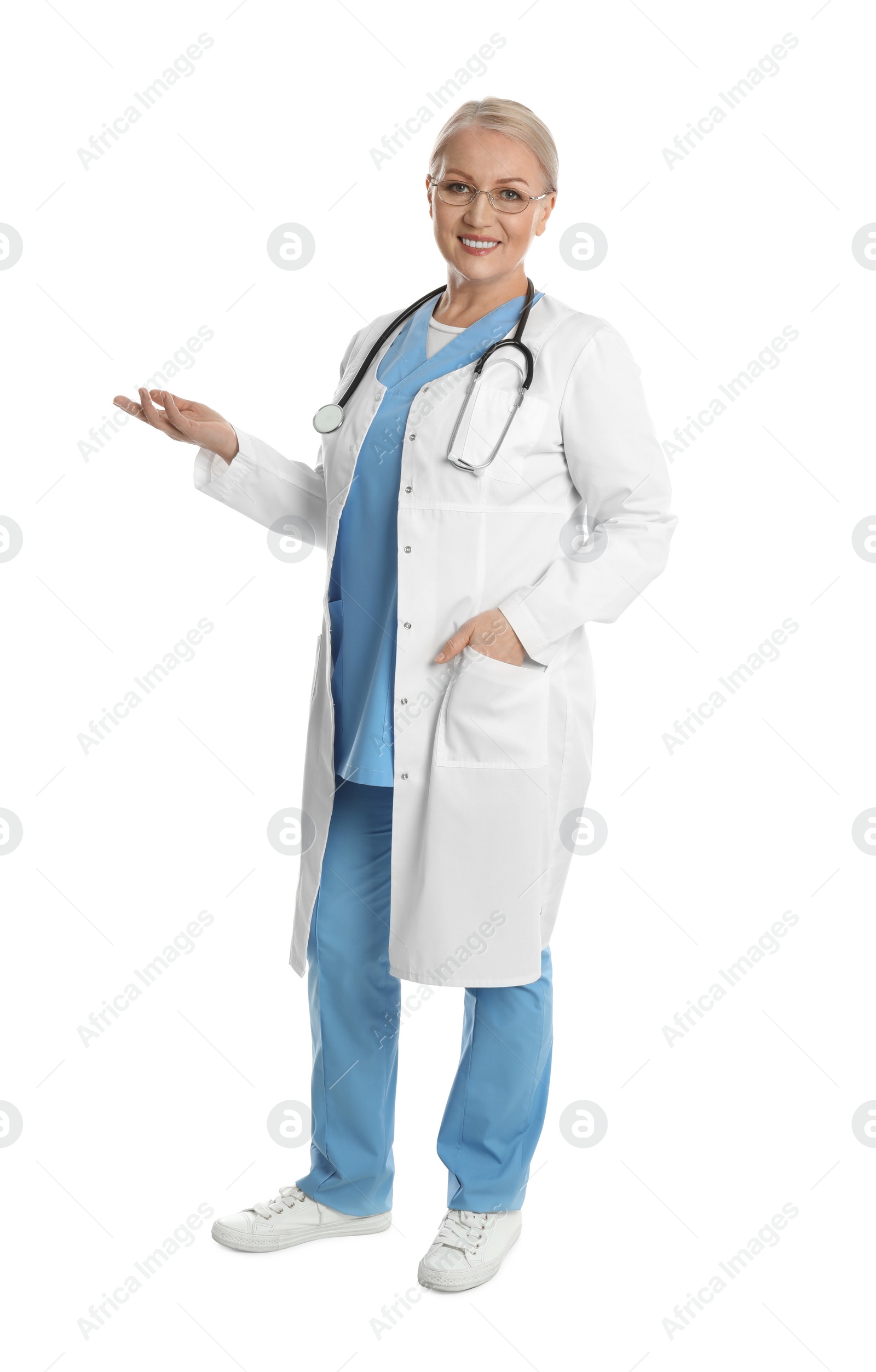 Photo of Full length portrait of mature doctor on white background
