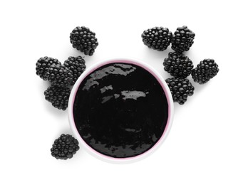 Photo of Blackberry puree in bowl and fresh berries on white background, top view