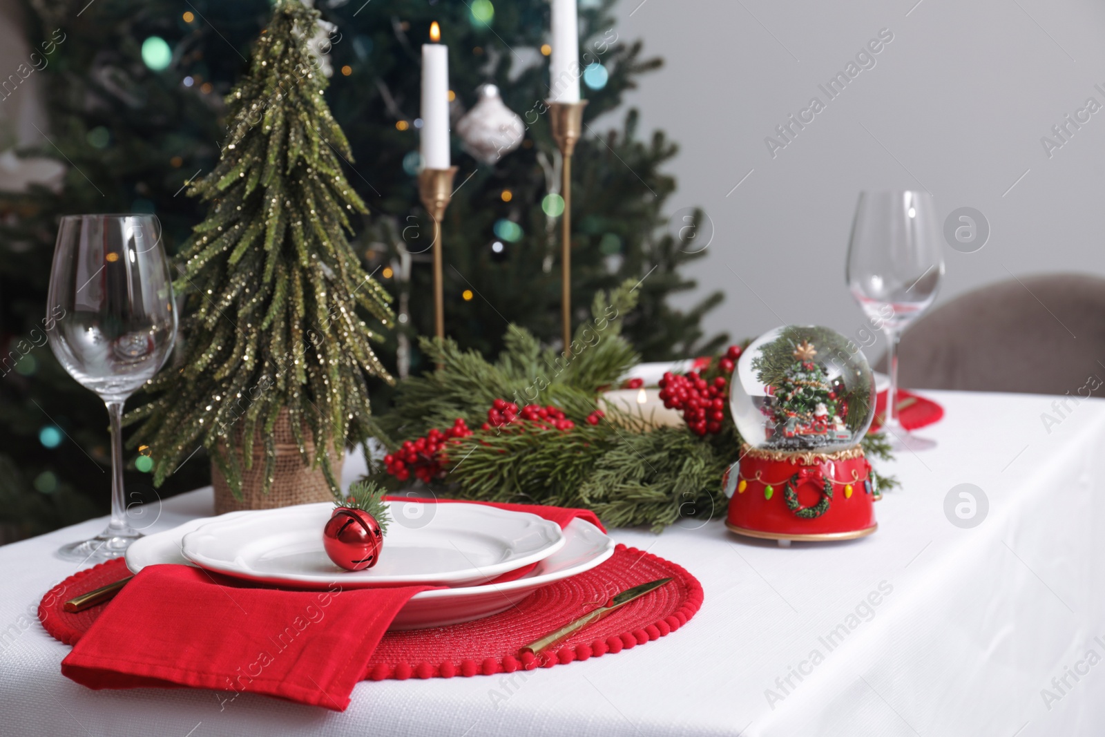 Photo of Luxury place setting with beautiful festive decor for Christmas dinner on white table. Space for text