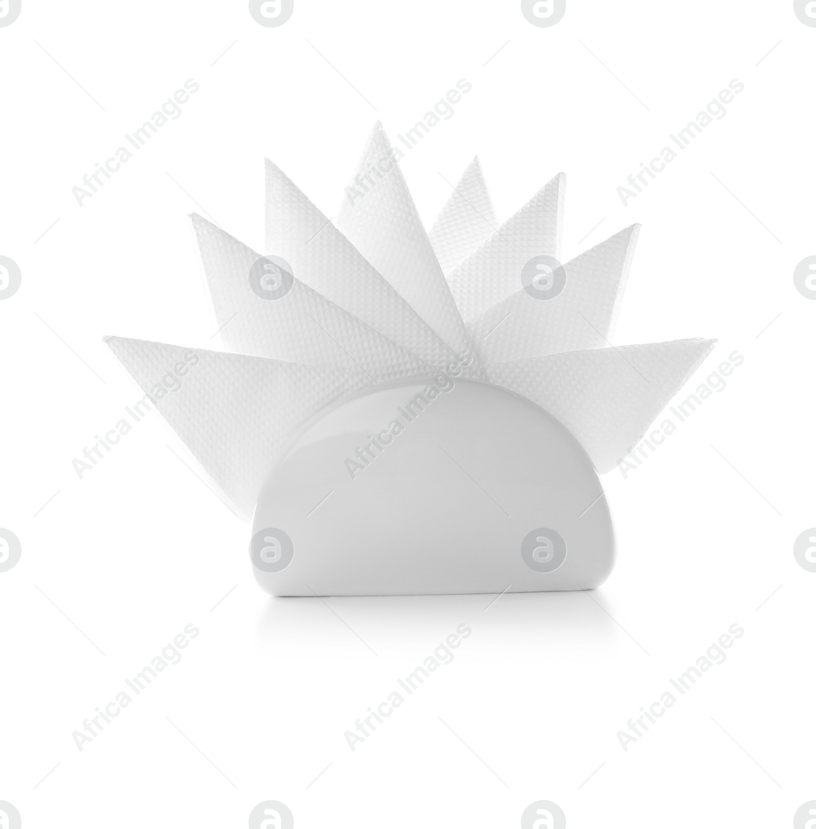 Photo of Napkin holder with paper serviettes on white background