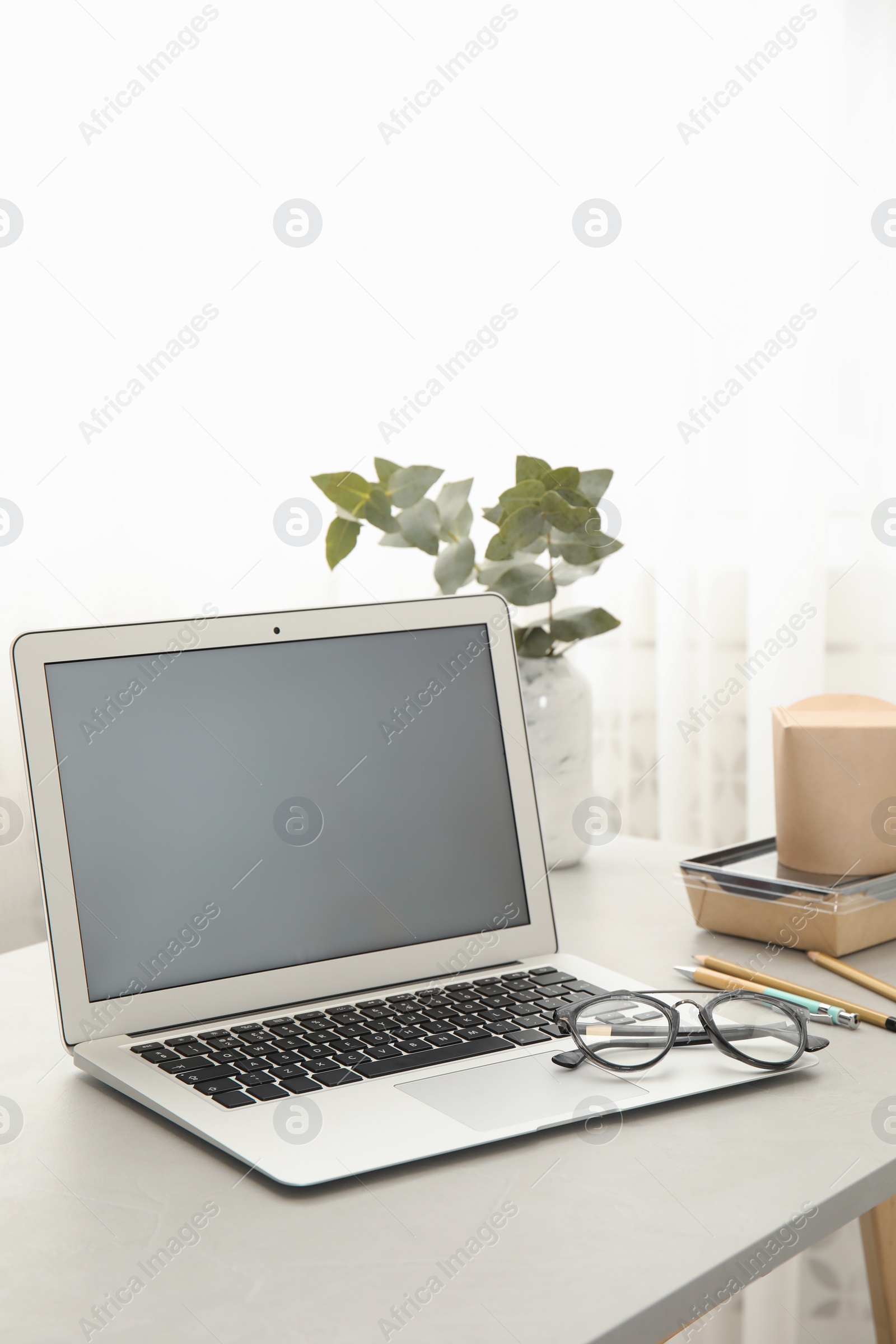 Photo of Cozy blogger workplace with laptop at home