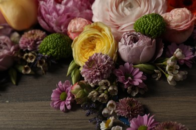 Bouquet of beautiful flowers on wooden background