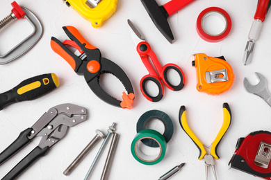 Flat lay composition with construction tools on white background