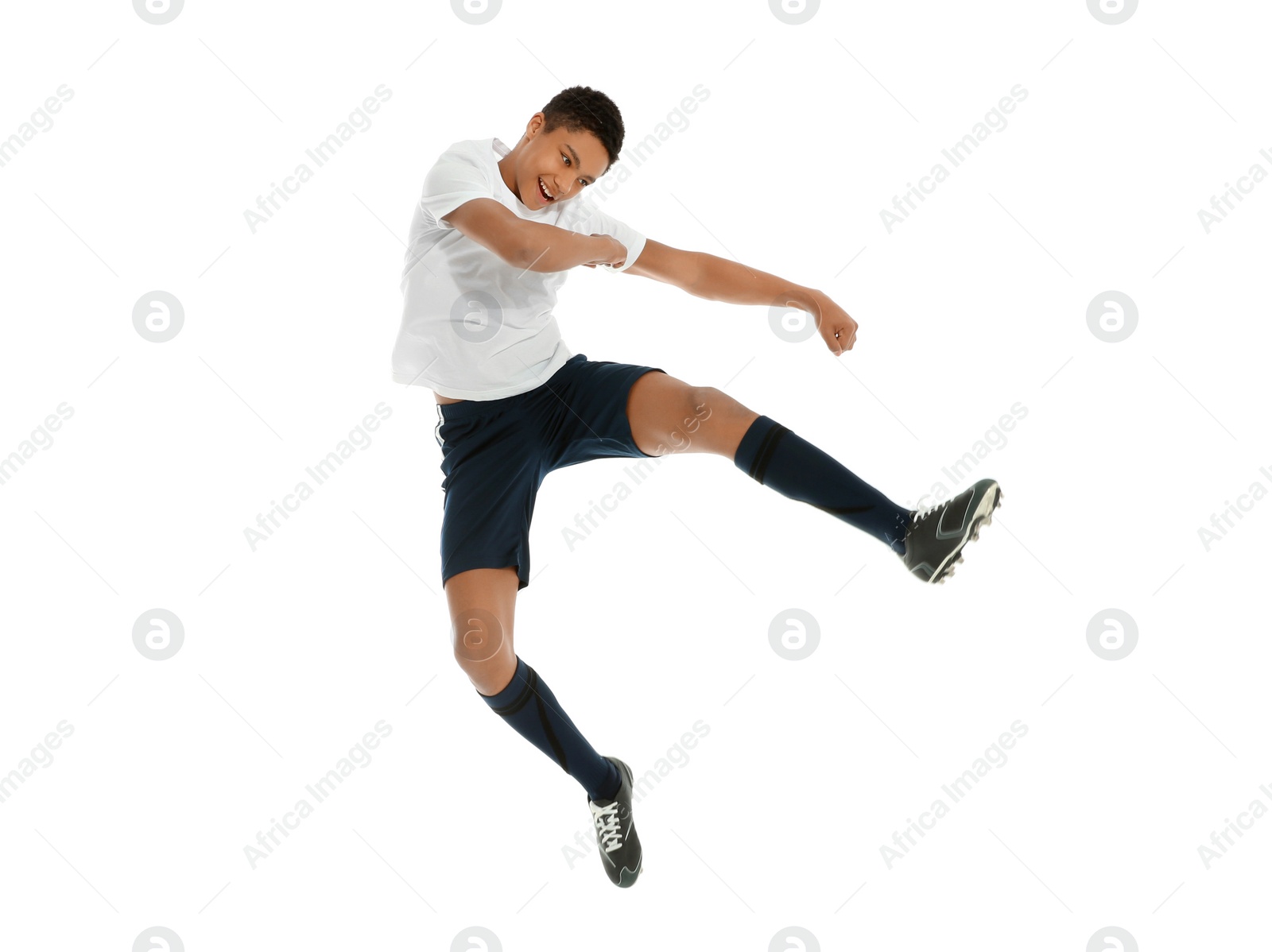 Photo of Teenage African-American boy playing football on white background