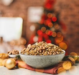 Traditional Christmas slavic dish kutia on table in decorated room