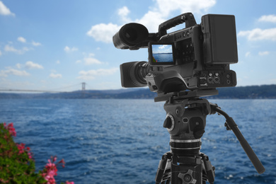 Image of Recording beautiful view of seascape on professional video camera