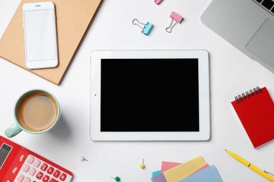 Photo of Tablet computer, laptop and cup of coffee on white background. Business trainer concept