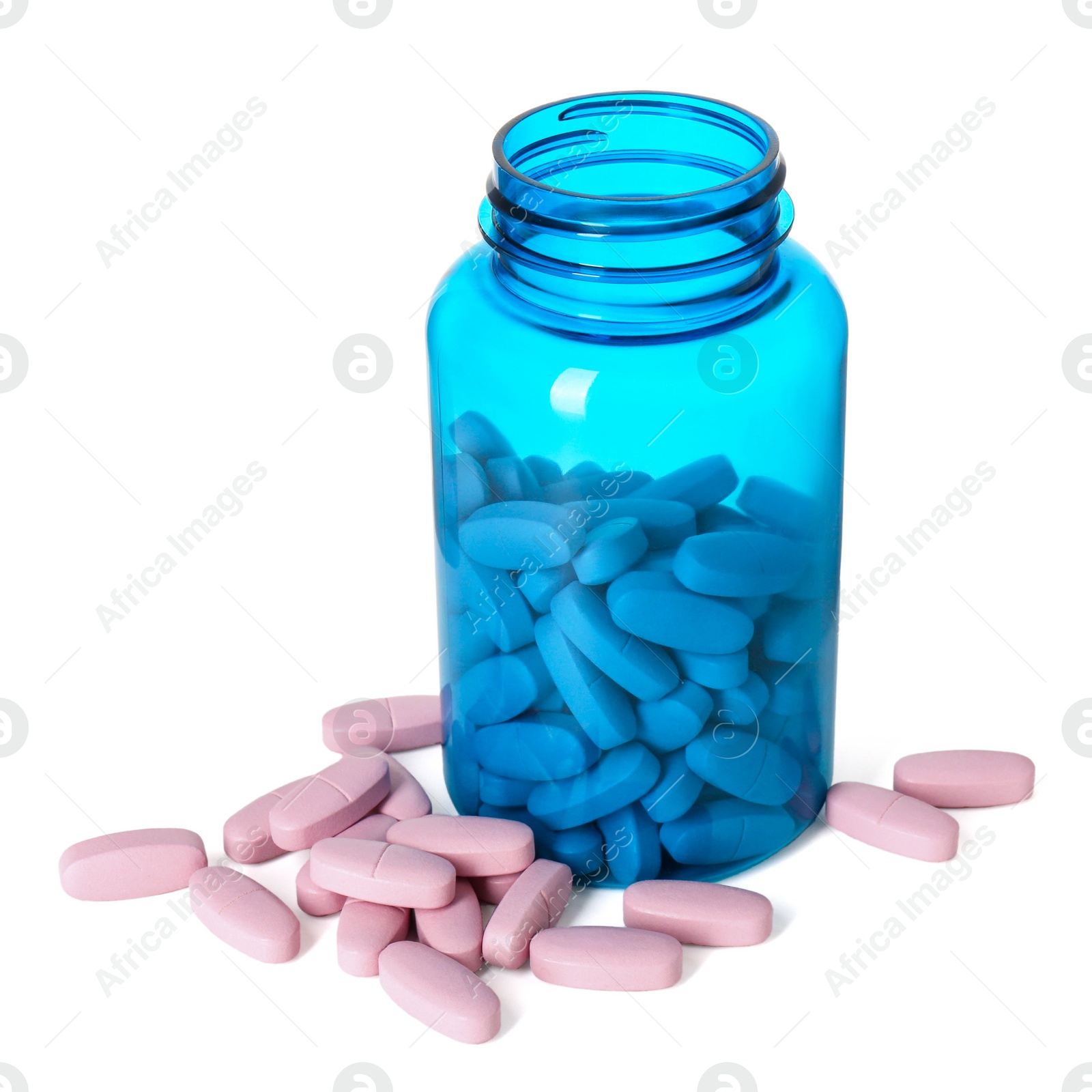 Photo of Bottle and pile of vitamin pills isolated on white