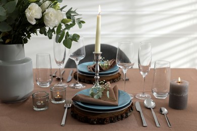 Photo of Festive table setting with beautiful tableware and decor indoors