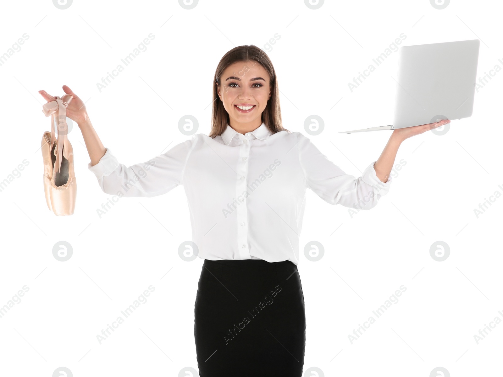 Photo of Portrait of businesswoman with ballet shoes and laptop on white background. Combining life and work