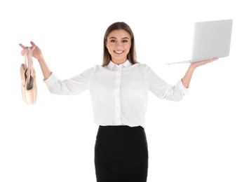 Photo of Portrait of businesswoman with ballet shoes and laptop on white background. Combining life and work