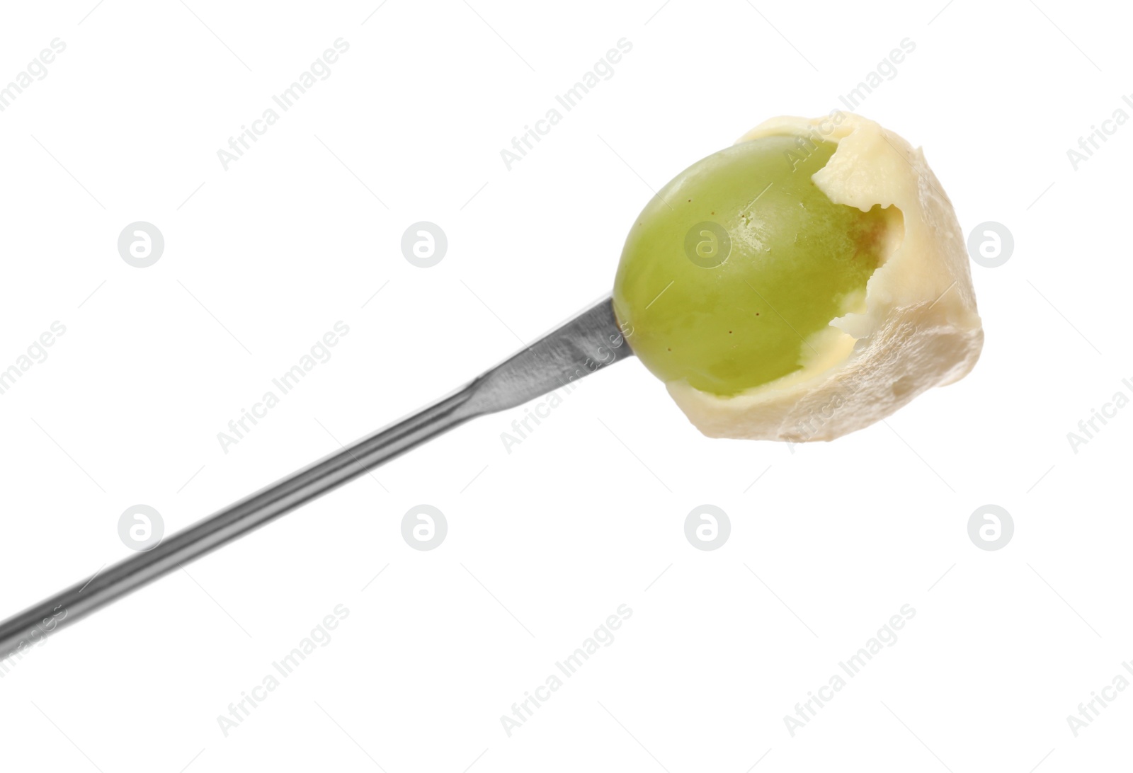 Photo of Tasty fondue. Fork with grape and melted cheese isolated on white