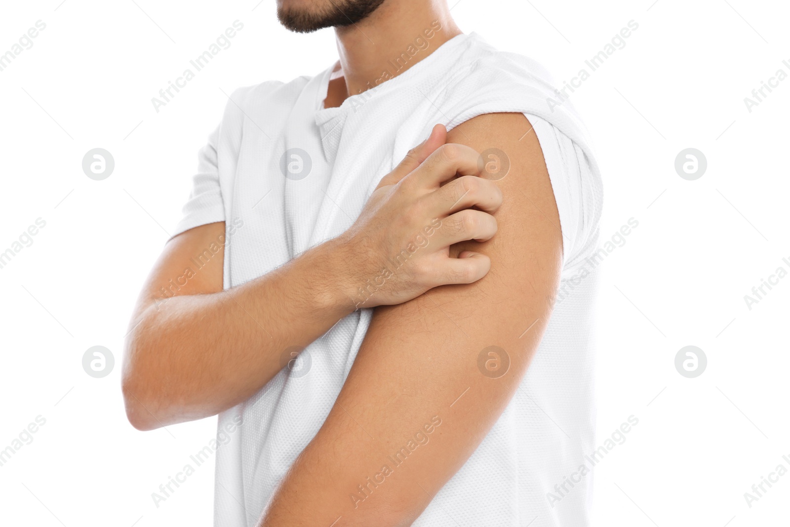 Photo of Young man scratching shoulder on white background, closeup. Annoying itch