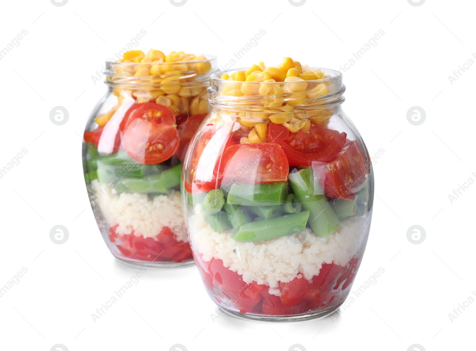 Photo of Healthy salad in glass jars isolated on white