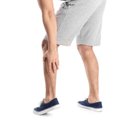 Man suffering from leg pain on white background, closeup