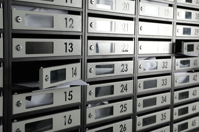 Photo of New mailboxes with keyholes, numbers and receipts