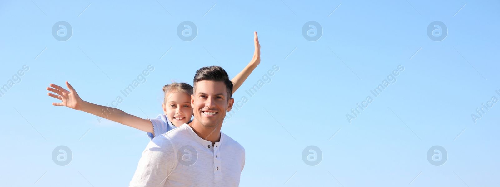 Image of Father and daughter having fun outdoors, space for text. Banner design