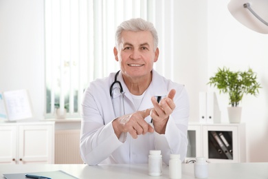 Doctor consulting patient using video chat in clinic, view from web camera