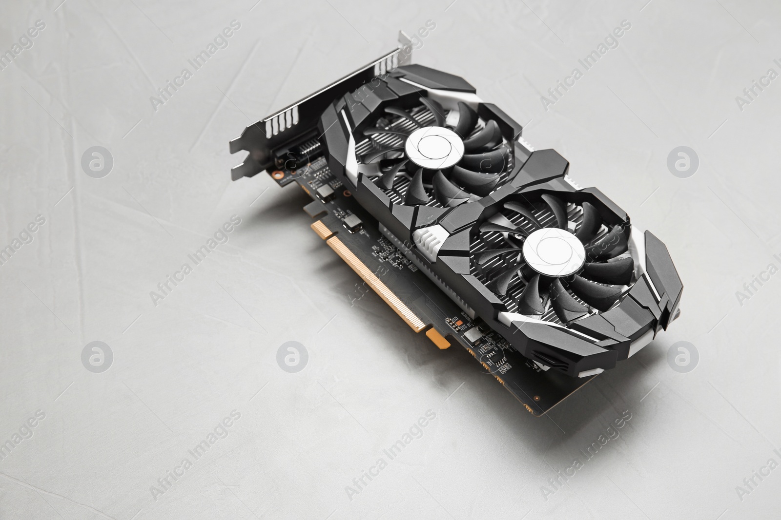 Photo of Computer graphics card on gray textured background, space for text