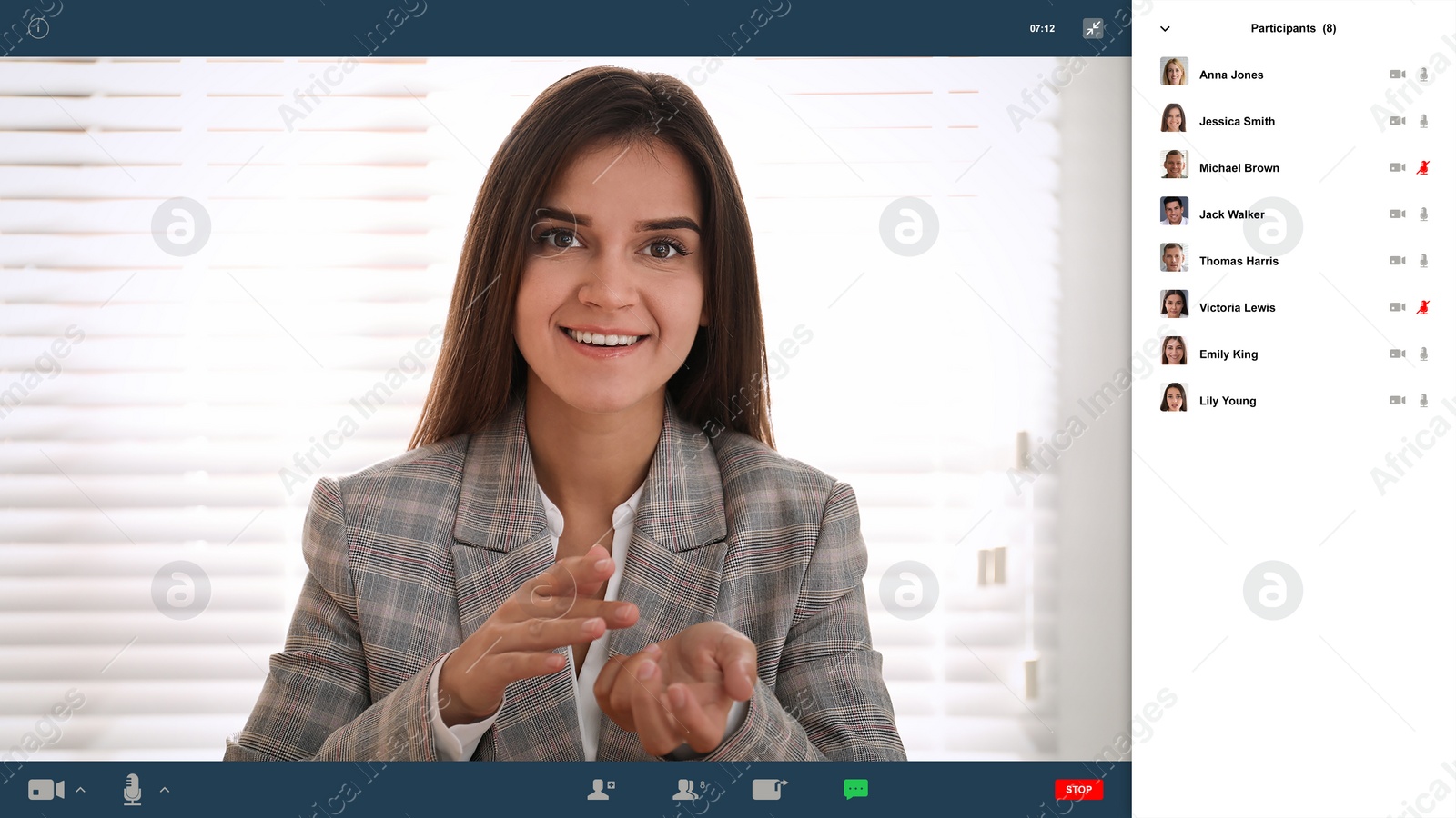 Image of Woman communicating with coworkers from home using video chat, view through camera