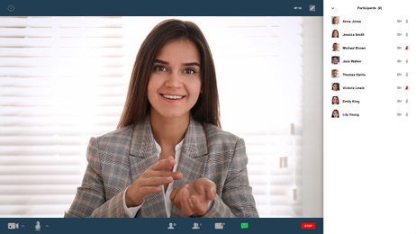 Woman communicating with coworkers from home using video chat, view through camera