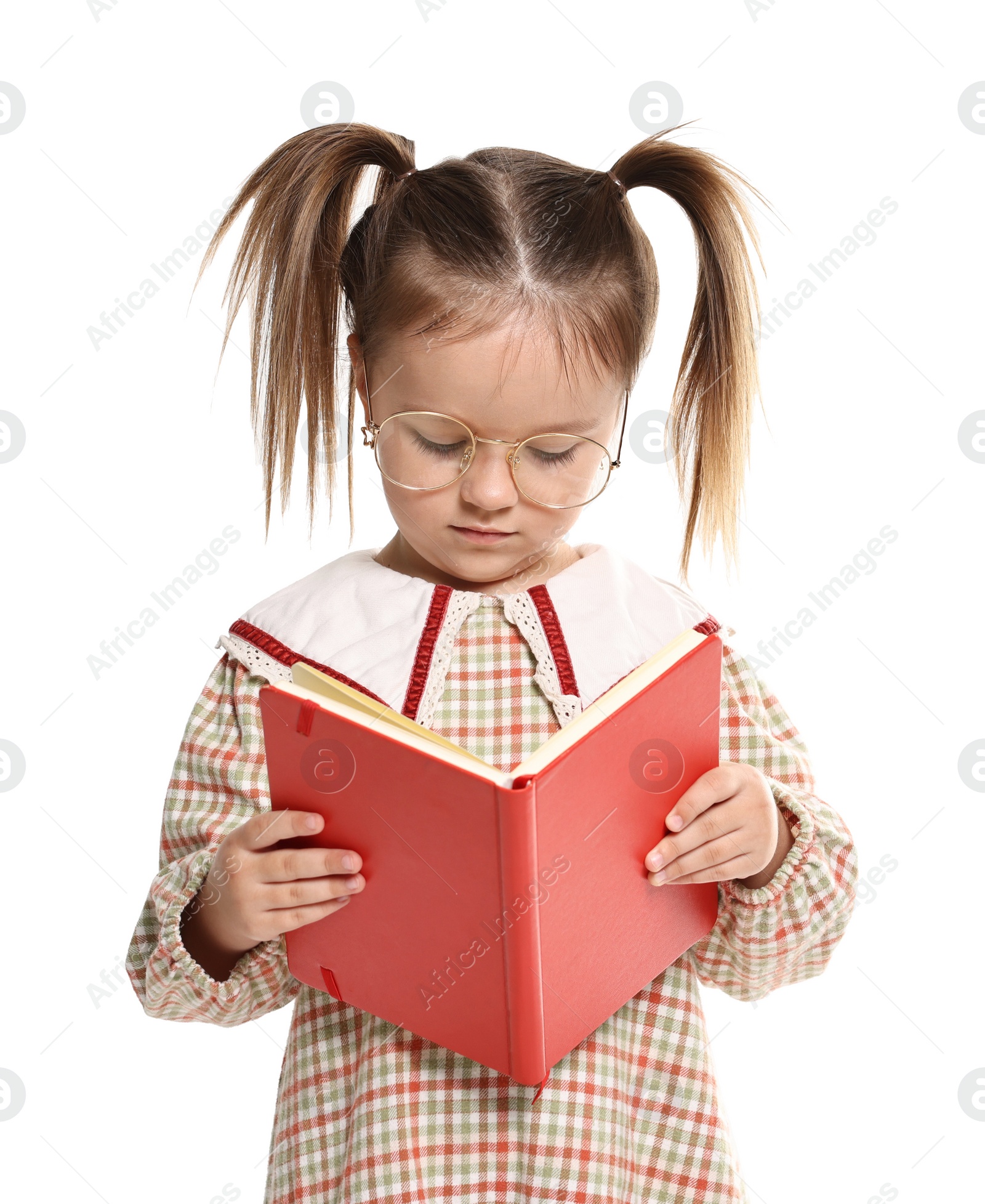 Photo of Cute little girl reading book on white background