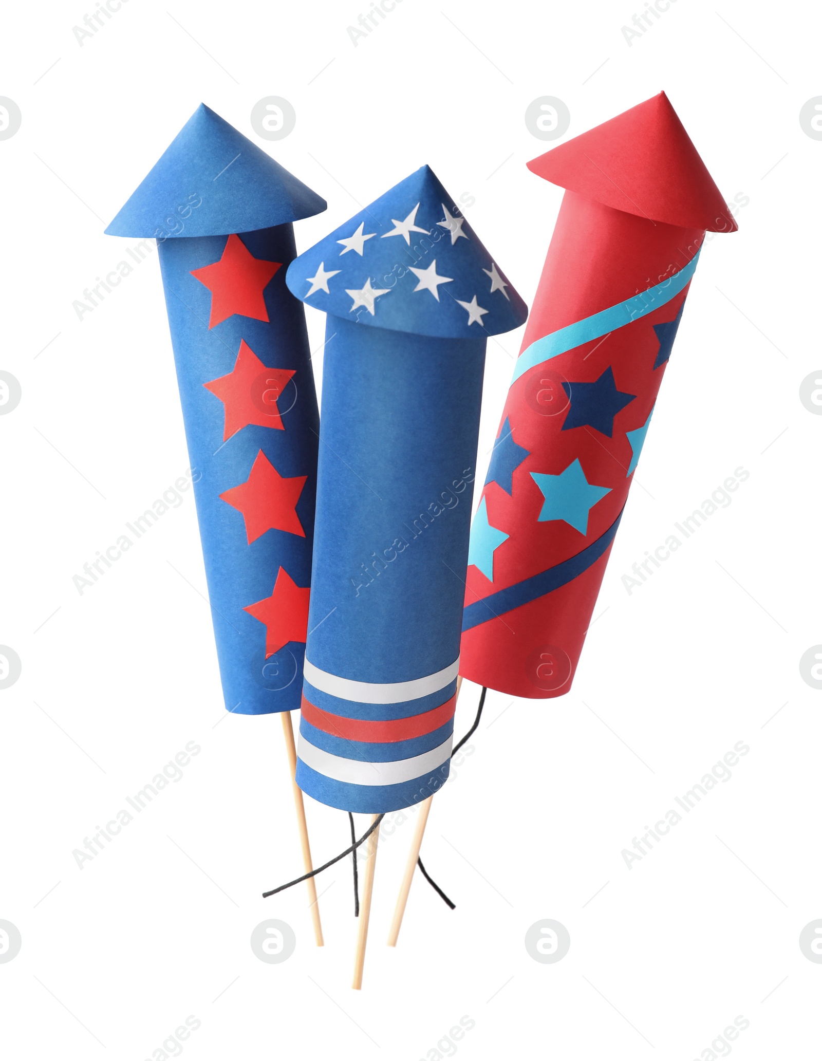 Photo of Firework rockets on white background. Festive decor