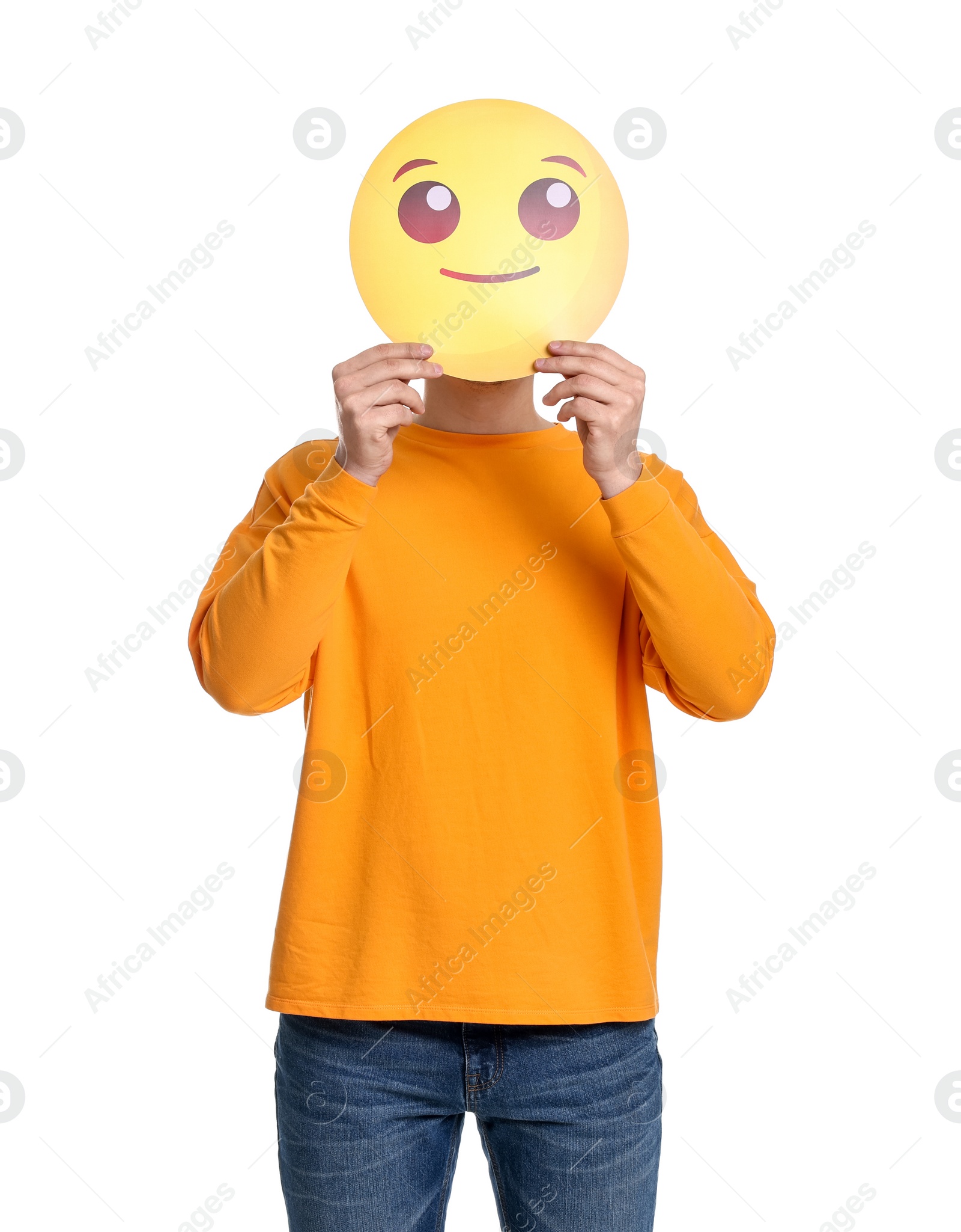 Photo of Man covering face with smiling emoticon on white background