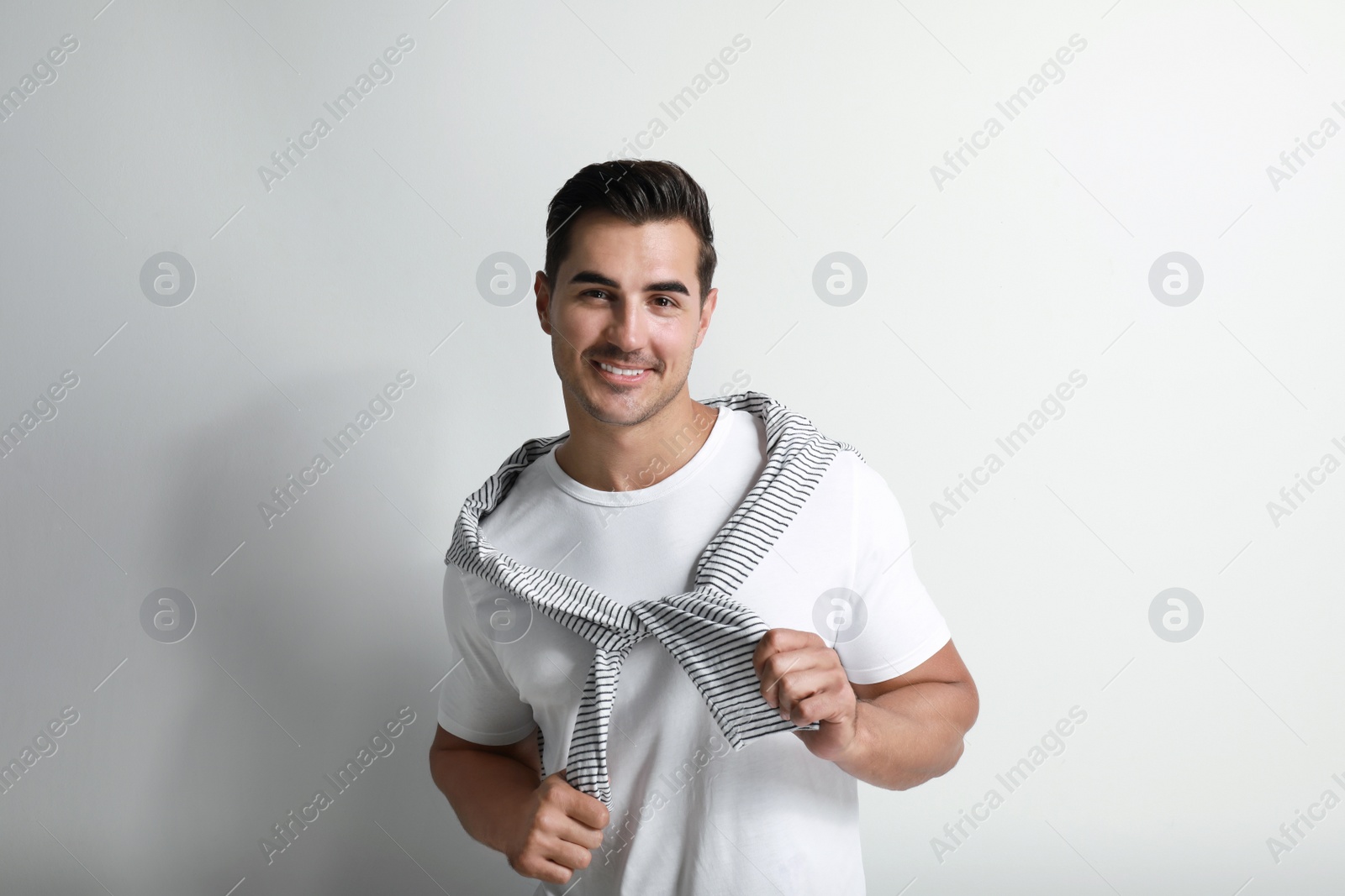 Photo of Portrait of handsome young man on white background