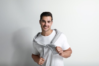 Portrait of handsome young man on white background