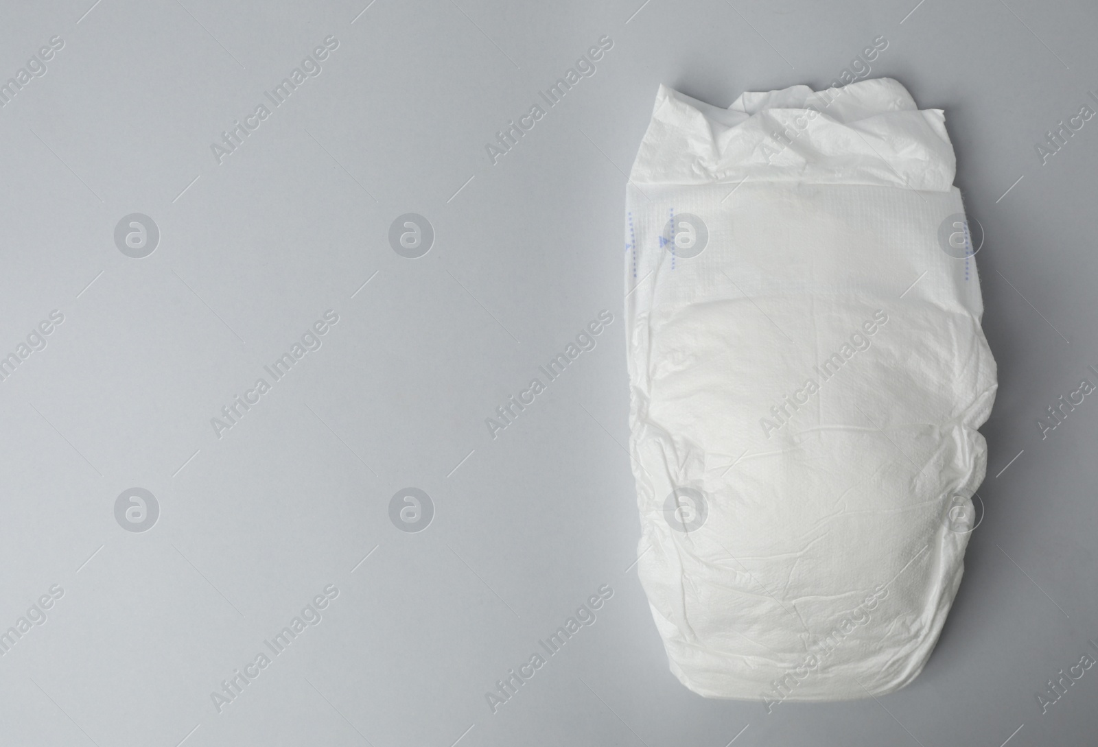 Photo of Baby diaper on grey background, top view. Space for text