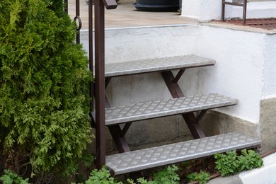 Photo of View of empty metal stairs with railing outdoors