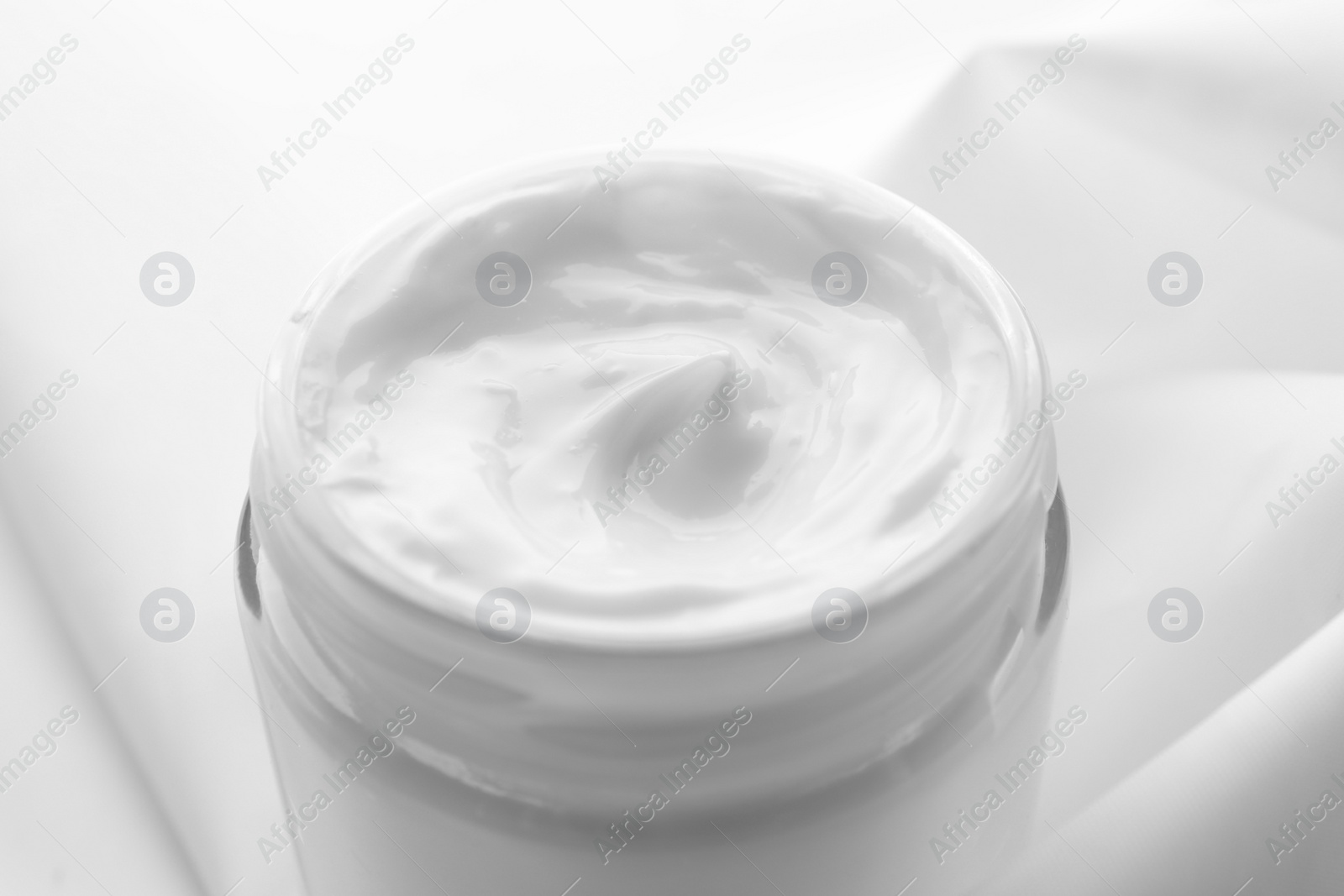 Photo of Jar of hand cream on white background, closeup