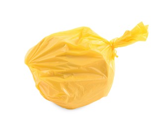 Photo of Yellow plastic garbage bag isolated on white