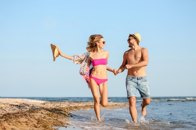 Young couple spending time together on beach