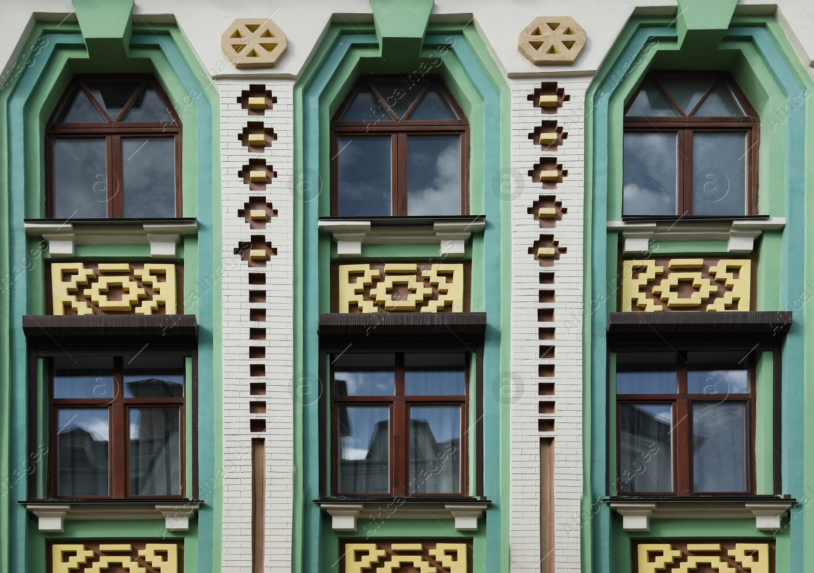 Photo of Wall of vintage building with beautiful windows