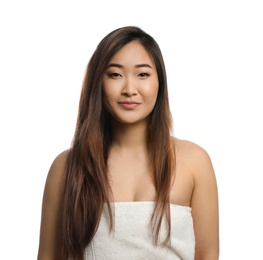 Photo of Portrait of beautiful Asian woman wrapped in towel isolated on white. Spa treatment
