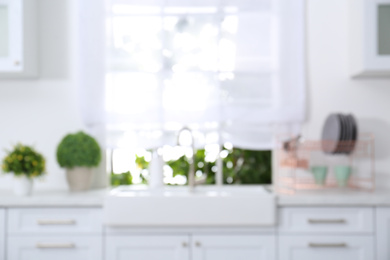 Photo of Blurred view of modern stylish kitchen interior