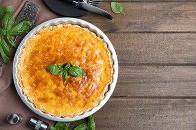 Photo of Delicious pie with minced meat on wooden table, flat lay. Space for text
