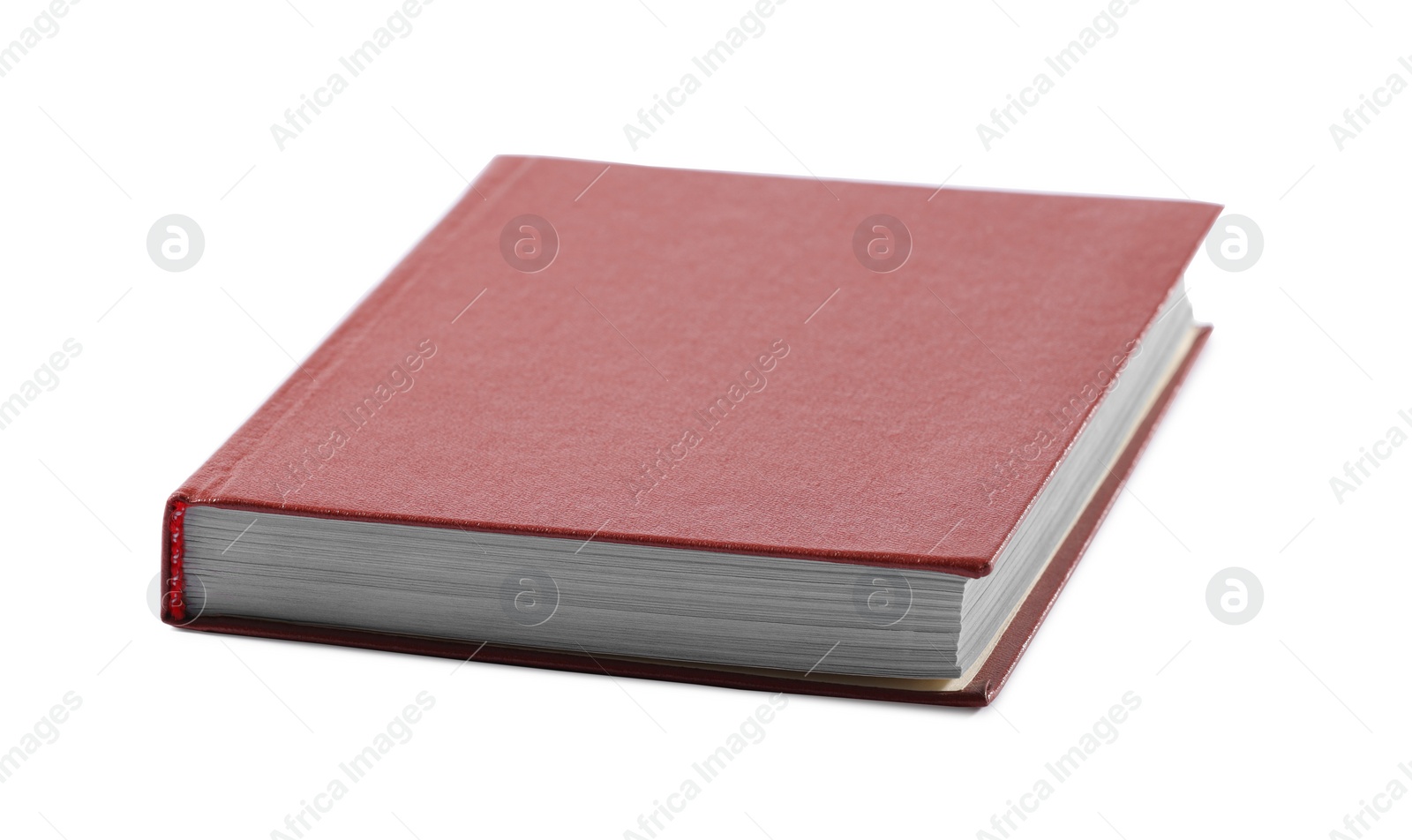 Photo of One closed red hardcover book isolated on white