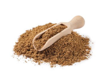 Photo of Heap of aromatic caraway (Persian cumin) powder and wooden scoop isolated on white
