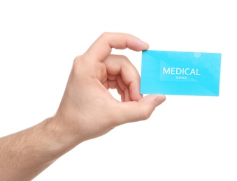 Photo of Man holding business card isolated on white, closeup. Medical service