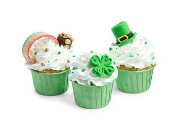 Photo of St. Patrick's day party. Tasty festively decorated cupcakes isolated on white