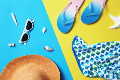 Photo of Flat lay composition with beach objects on color background